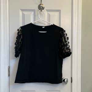 Elegant Black Top with Floral Sleeves